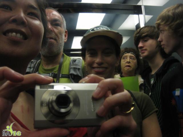 Self-photograph using the shiny interior of the elevator to the tower at Golden Gate Park