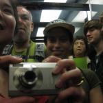 Self-photograph using the shiny interior of the elevator to the tower at Golden Gate Park