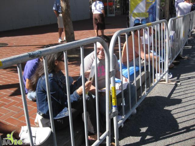 Waiting for the parade and reading a VSK from pre-parade leafleting by Ann, Katherine, Mila, Reeba and Tammy 