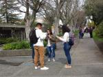 More students reading leaflets