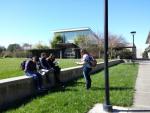 Students reading leaflets