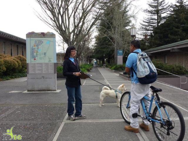 Peggy and Lao talking to interested student