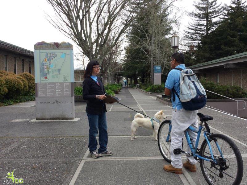 Peggy and Lao talking to interested student
