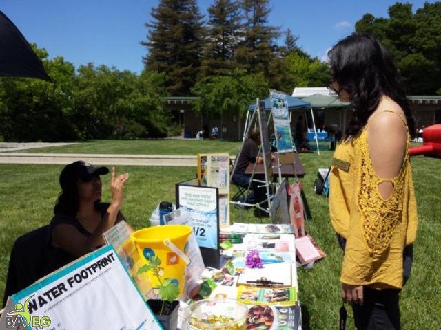 NVC - Quizmaster Mila talking to student organizer