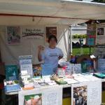 Sunday setup done. Tammy shows off the yummy vegan cookies we were giving away (donated by Sun Flour Baking Company)