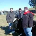 Regina, Chris, and Nicole with bovine friend