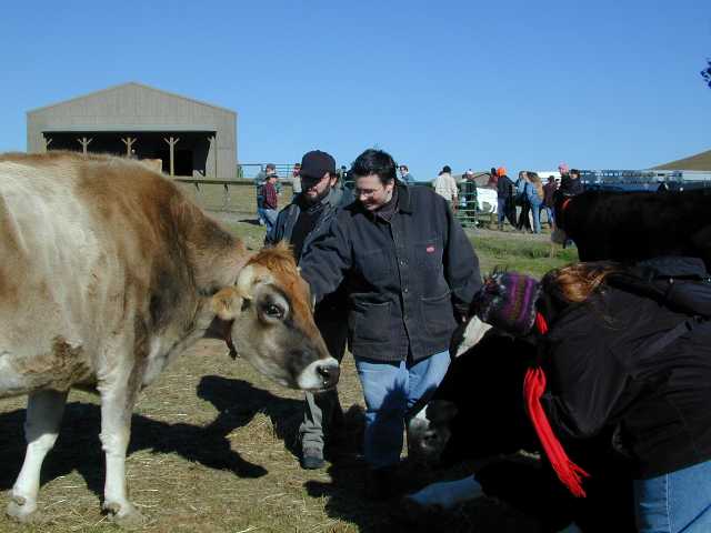 Chris & Regina between bovine friends