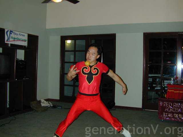 Wayne dressed as a red acrobat