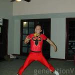 Wayne dressed as a red acrobat