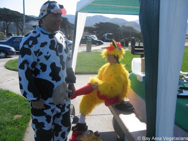 The costumed cow and chicken emerge