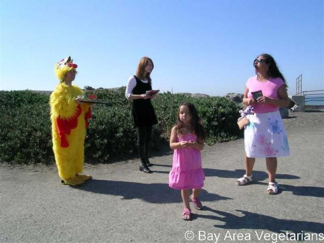 Tammy in chicken costume with Elizabeth leafleting