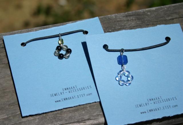 Glass beads pendant hangs from a cotton cord with silver color lobster clasp